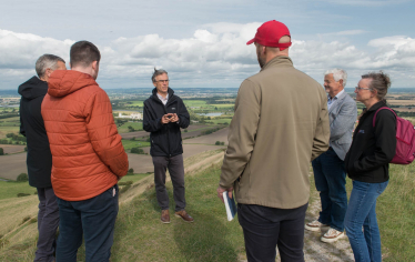 Andrew at top of the White Horse with English Heritage staff and volunteers